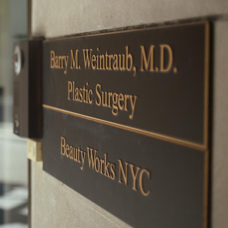 Sign displaying Barry M. Weintraub, MD, FACS Plastic Surgery