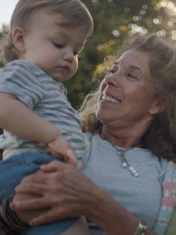Sandi holding her grandson